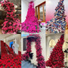 A collection of vibrant artificial rose stems in various shades of pink and red used for weddings and home decor.