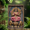 A metal wall art statue of Goddess Durga and Lakshmi seated in an ornate frame surrounded by elephants.