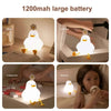 A white LED duck night light is shown in various settings, including a study desk and a bathroom sink.