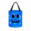 A glowing blue pumpkin candy bucket with an LED handle.