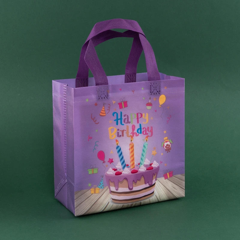 A purple reusable happy birthday gift bag with a birthday cake design on the front.
