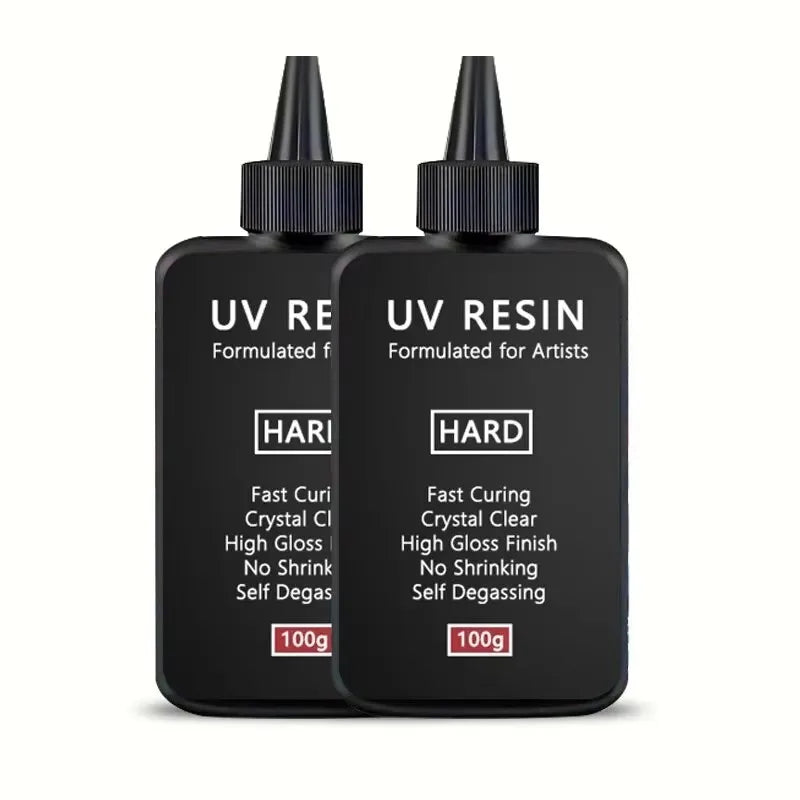 Black UV resin bottles with dropper caps labeled UV Resin Formulated for Artists and HARD