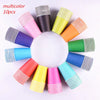 A colorful set of 10 disposable paper cups in various solid colors and striped patterns arranged in a circle.