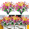 A vibrant bouquet of artificial flowers in various colors including pink, purple, yellow, and white arranged for home or even