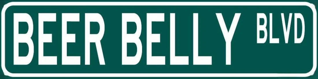A dark green rectangular sign with white text reading BEER BELLY BLVD