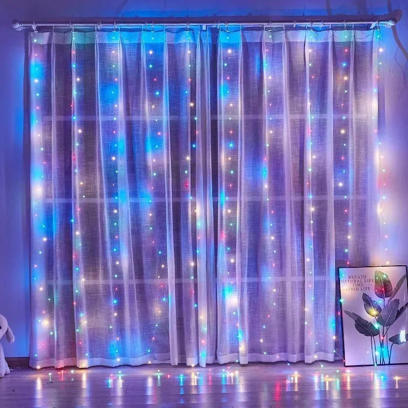 Purple sheer curtain illuminated with vertical strings of blue and pink fairy lights.