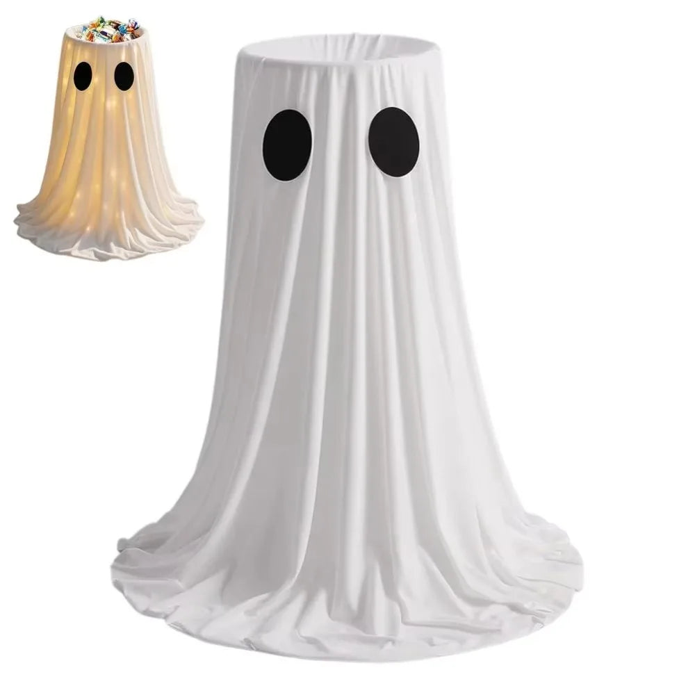 A white ghost Halloween treat bucket with a sheer fabric drape and two black eyes, illuminated from within.