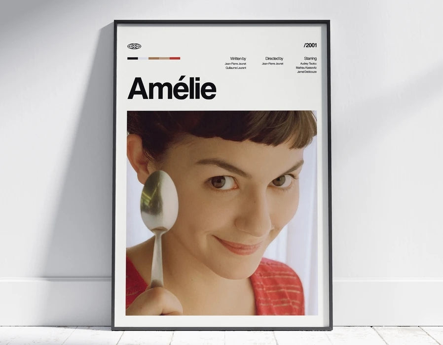 A framed portrait of a young woman named Amélie with a spoon in her hand.
