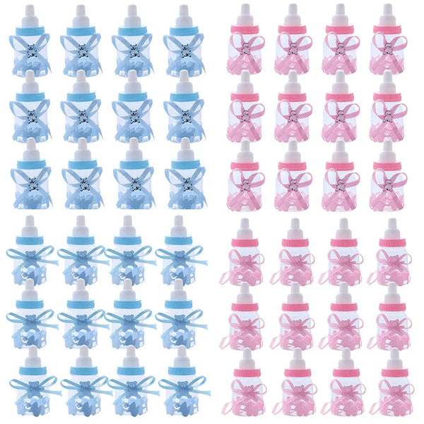Assortment of pink and blue baby bottle candy favor boxes for baby showers and gender reveals