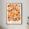 Wall art poster featuring a floral pattern of orange and brown pumpkins with the word PUMPKINS below.
