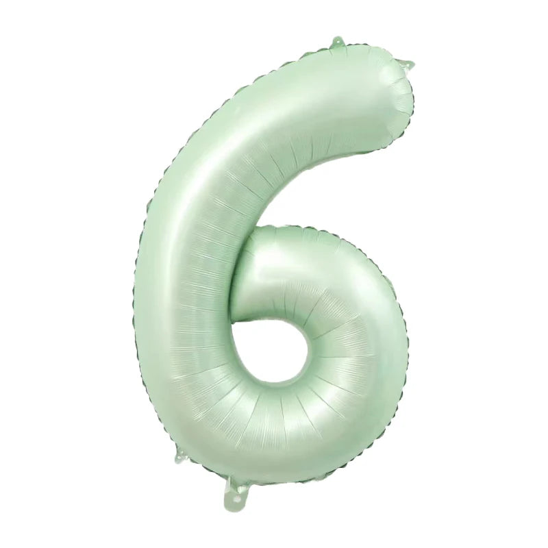 A light mint green foil number balloon shaped like the number six.
