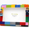 A colorful building block photo frame kit featuring a white frame and figures.