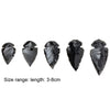 A set of natural black obsidian arrow pendants showing a size range of 3 to 8 centimeters.
