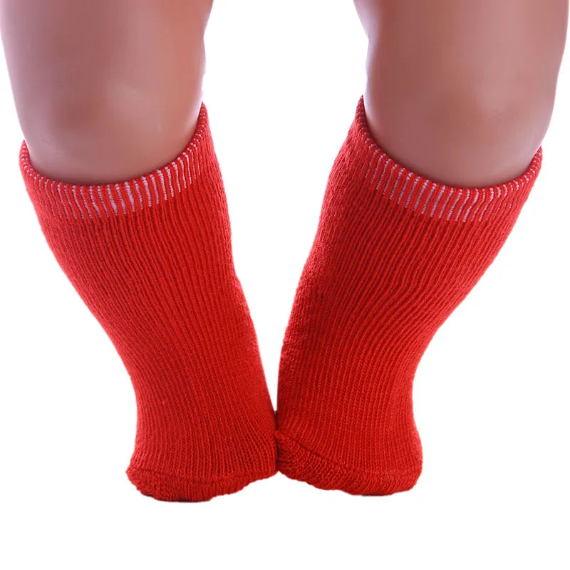 Pair of bright red knitted socks for dolls