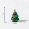 A small green resin Christmas tree charm with a gold star on top, shown against a white background.