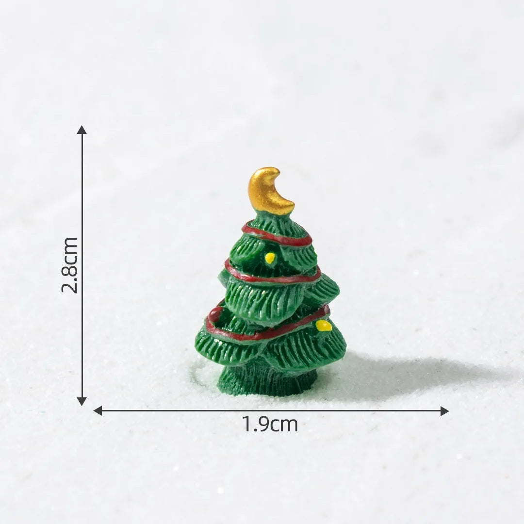 A small green resin Christmas tree charm with a gold star on top, shown against a white background.