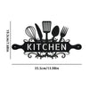 Black rustic farmhouse metal wall sign featuring kitchen utensils like a whisk, fork, and spoon.