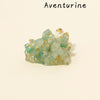 A cluster of light green aventurine crystals with gold inclusions.