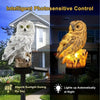 A pair of photosensitive owl garden lights illuminating an owl statue during the day and at night.
