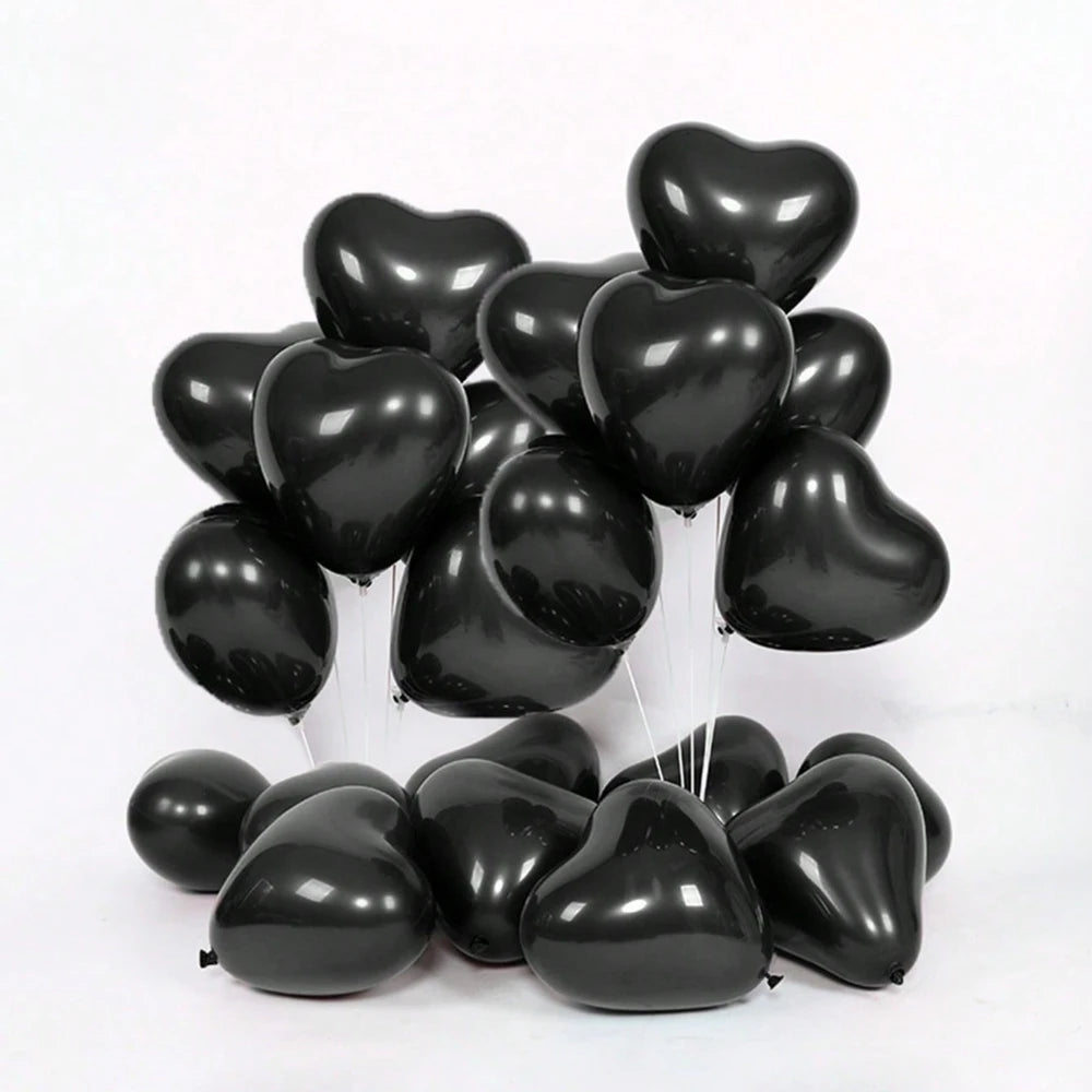 A cluster of black heart-shaped latex balloons for romantic celebrations.