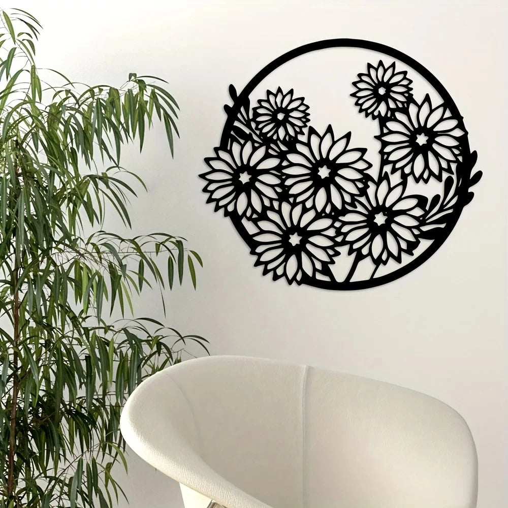 Black metal wall art featuring a silhouette of a dense floral pattern on a white wall.