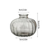 Modern clear glass vase with ribbed texture, measuring 4cm wide and 9cm tall.