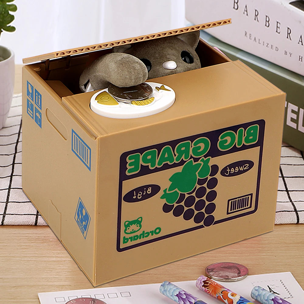 A cardboard box containing a small gray panda figurine and a coin-saving mechanism.