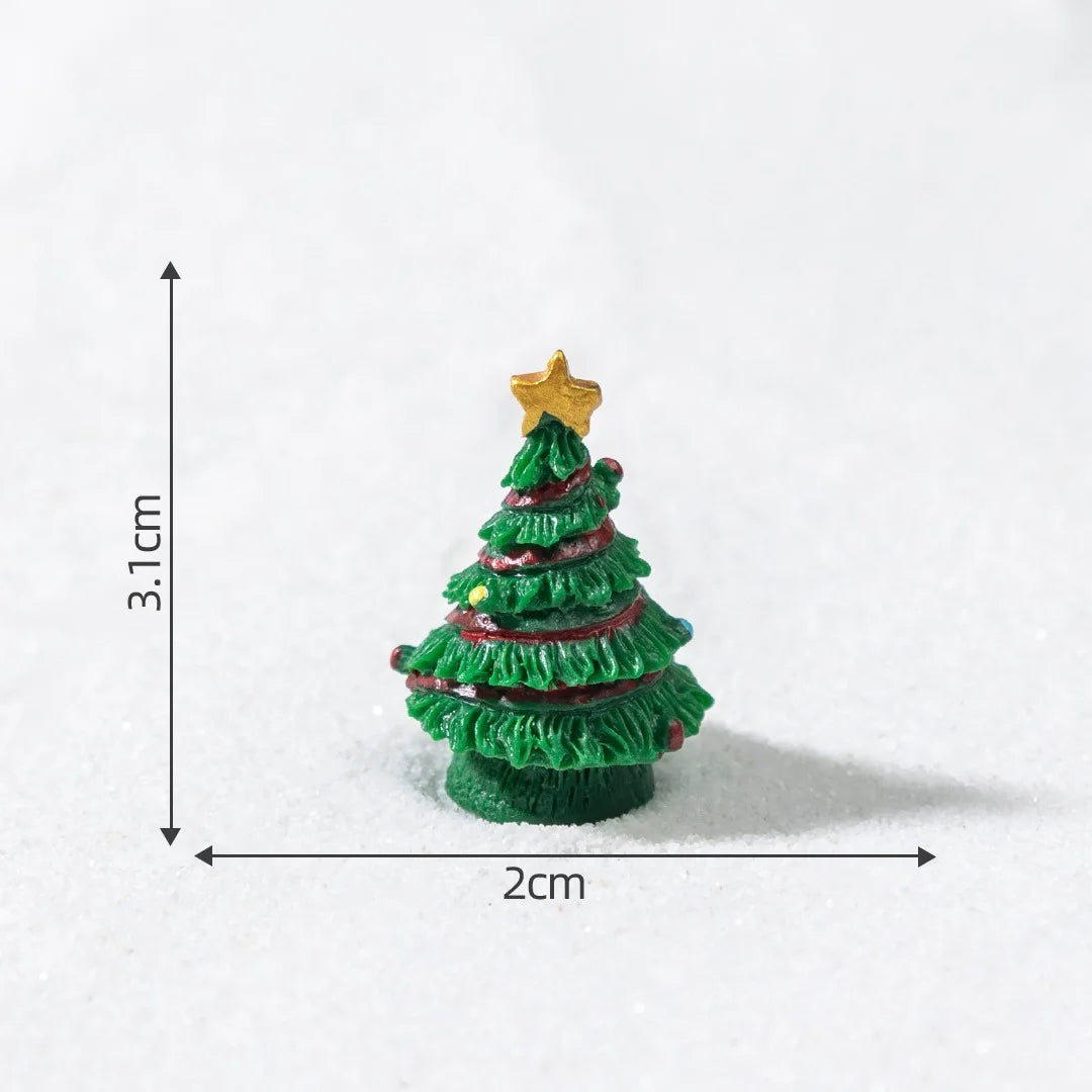 A small, green resin Christmas tree charm with a gold star topper, shown against a white background.
