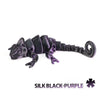 A black and purple articulated dragon lizard figurine.
