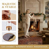 A woman decorates a fireplace mantel with a gold LED candle holder, showcasing majestic and stable elegance.