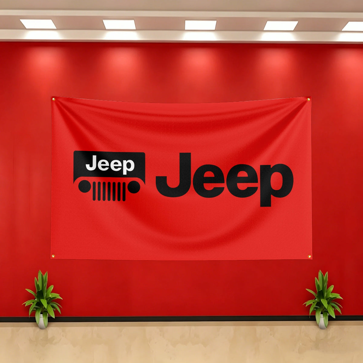 A red fabric banner featuring the Jeep logo in black on a wall.
