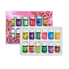 A set of essential oils in glass bottles with labels for various scents like Lavender, Rose, and Orange.