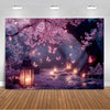 A dark forest scene with pink blossoms and glowing lanterns, featuring butterflies in a dreamy purple light.