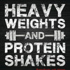 Graphique de texte avec la phrase HEAVY WEIGHTS AND PROTEIN SHAKES en police blanche délavée sur fond sombre.
