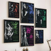 A gallery wall display featuring several posters from the Resident Evil franchise, including Ada Wong and Leon Kennedy.