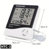 A white LED digital thermometer and hygrometer with an alarm clock display showing temperature, humidity, and time.