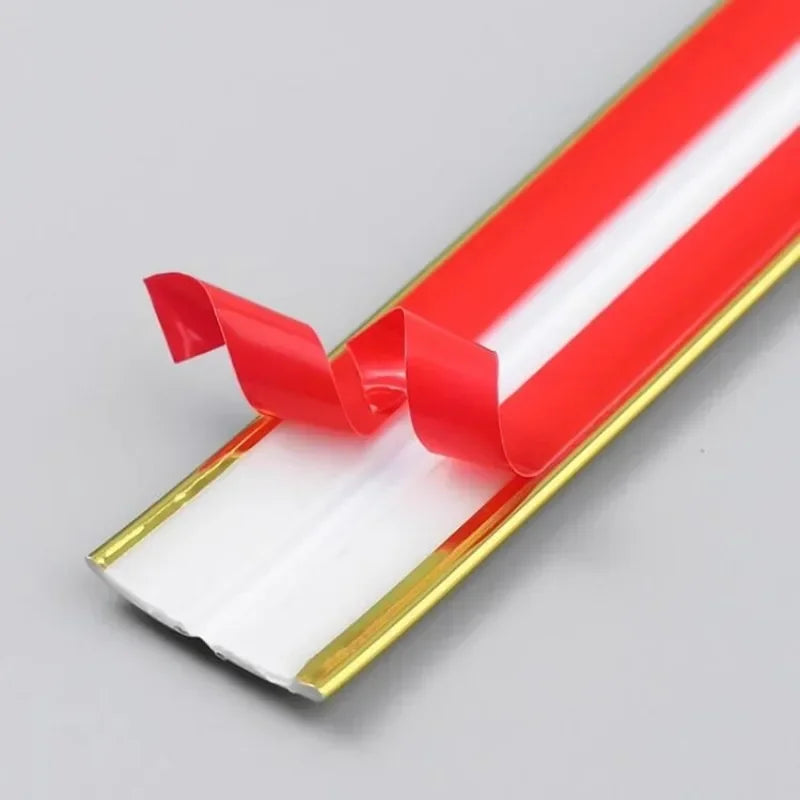 Red and white self-adhesive PVC edge guard strip used for protecting cabinet, table, or corner edges.