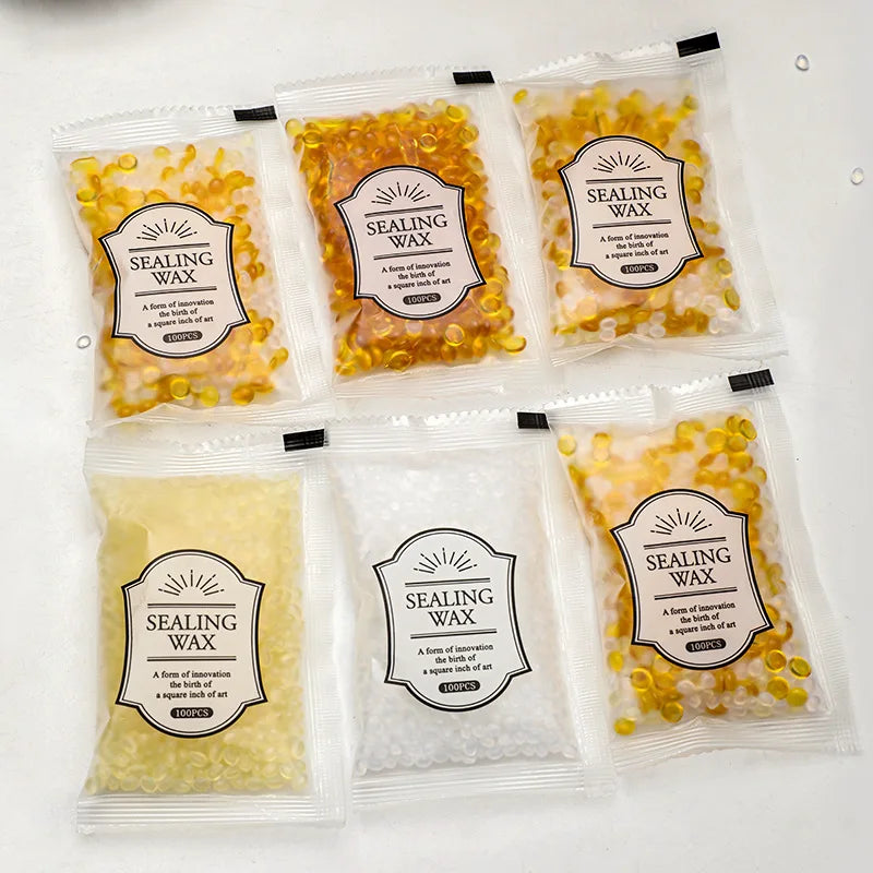 Pack of yellow and white sealing wax beads in small plastic bags for custom stamps