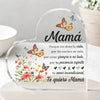 A clear heart-shaped ornament featuring floral designs and the text Mamá Porque me diste la vida por las noches en vela por e