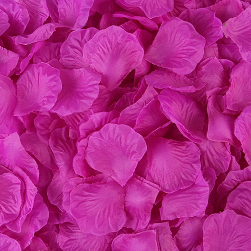 A close-up view of vibrant magenta silk rose petals used for weddings, parties, and home decor.