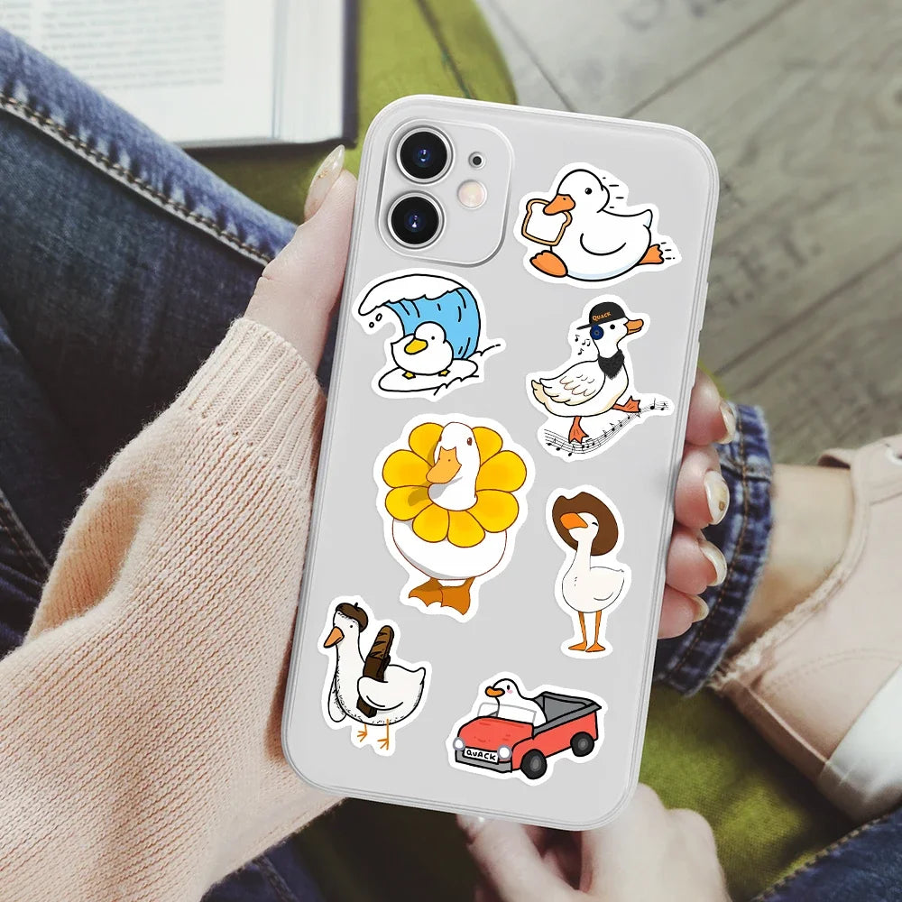 A white smartphone displaying various funny cartoon duck and goose decals on a clear background.