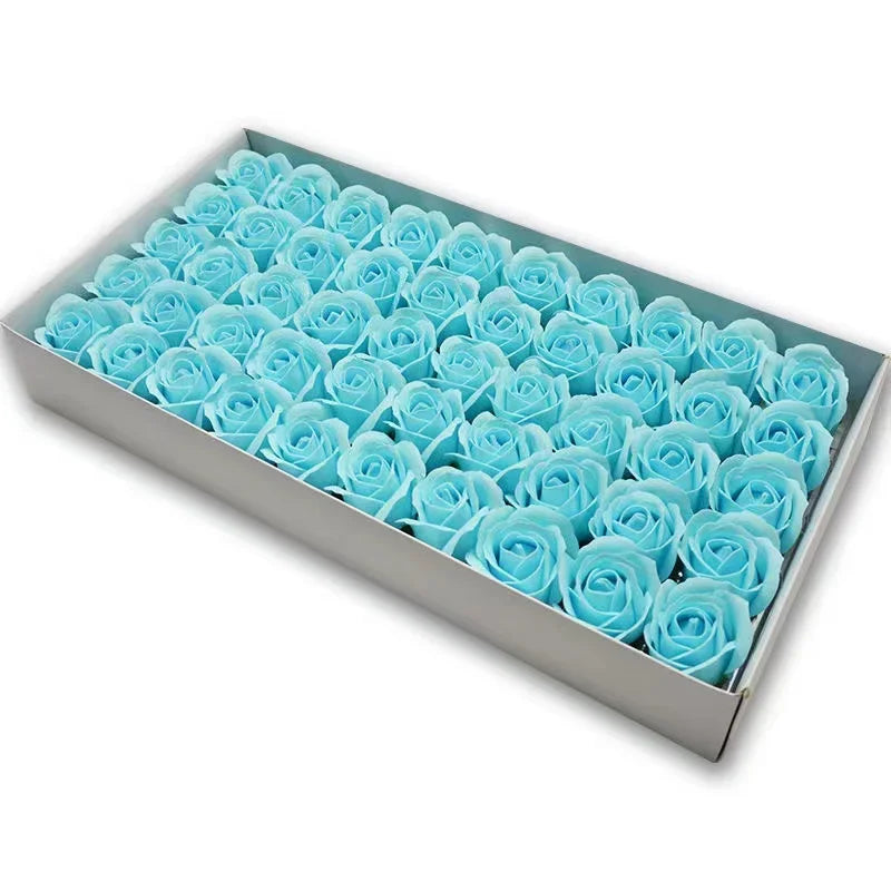 A rectangular box filled with numerous light blue artificial rose flower heads.