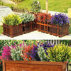A row of wooden planters filled with colorful artificial lavender and flowering plants for outdoor decor