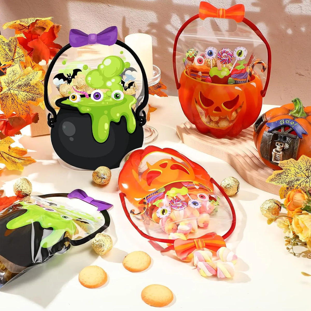 A set of Halloween trick or treat candy bags with orange and green designs displayed on a white surface.