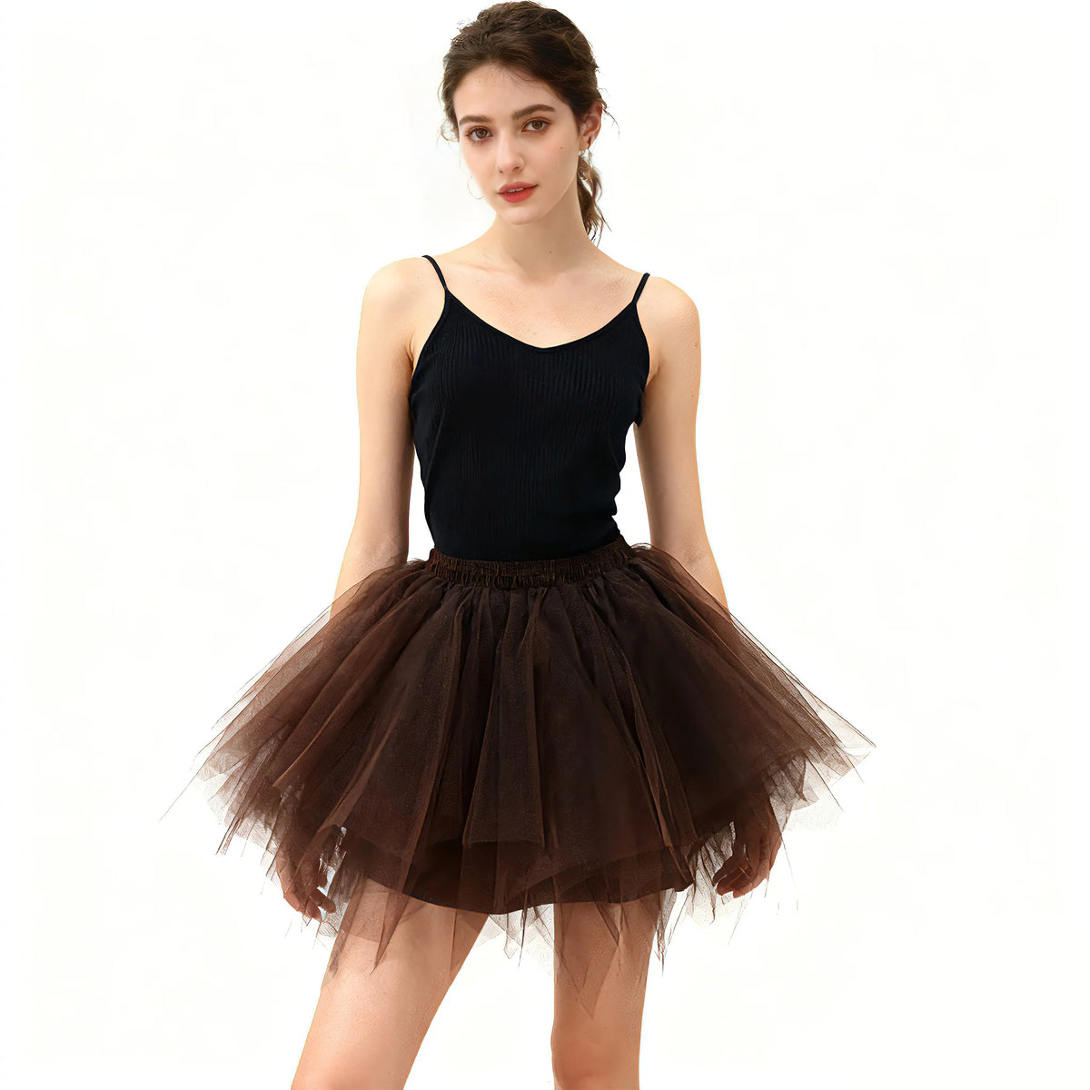 A woman models a black fitted top and a brown tulle tutu skirt.