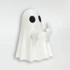 A white glow-in-the-dark ghost figurine with a playful pose.