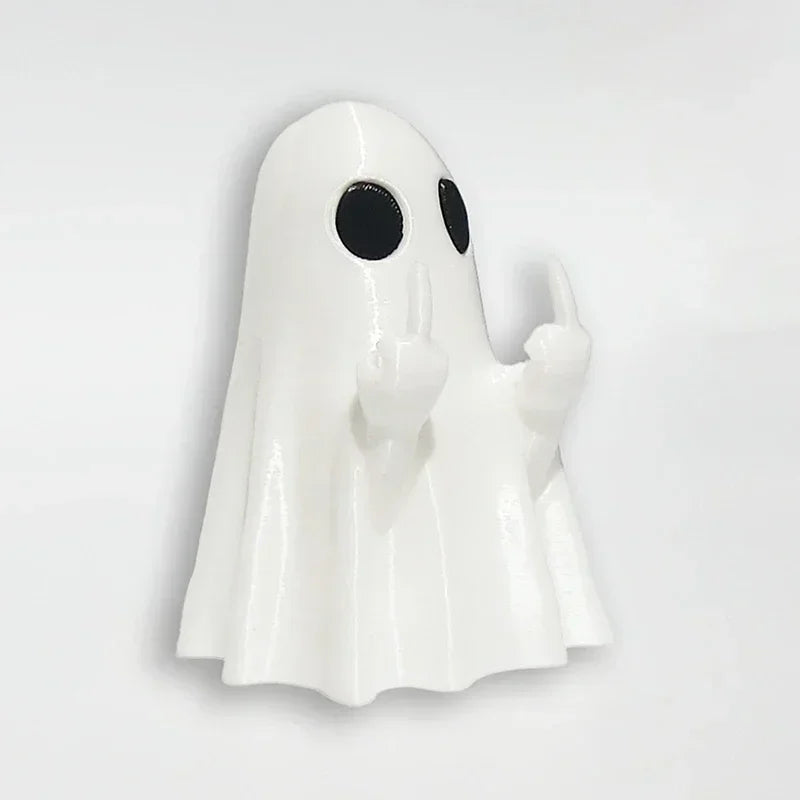 A white glow-in-the-dark ghost figurine with a playful pose.
