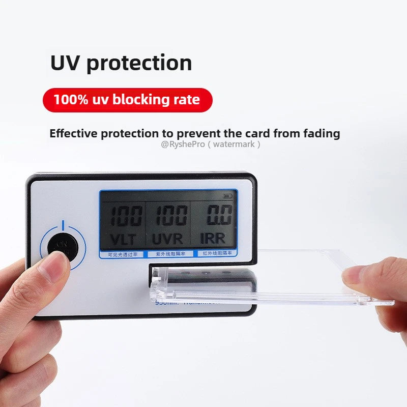 A hand holds a black device with a digital display and a clear card holder, demonstrating UV protection features.