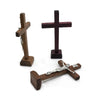 Handcrafted wooden crucifix with a cross and stand.