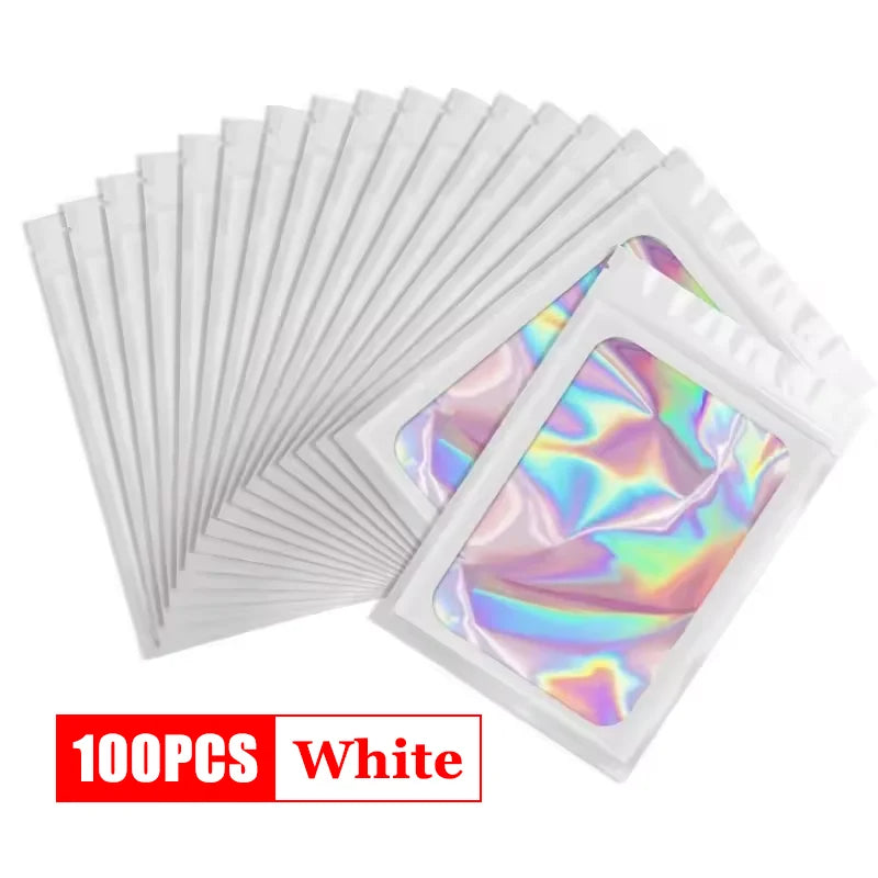A stack of 100 white holographic ziplock bags for jewelry and small item storage.